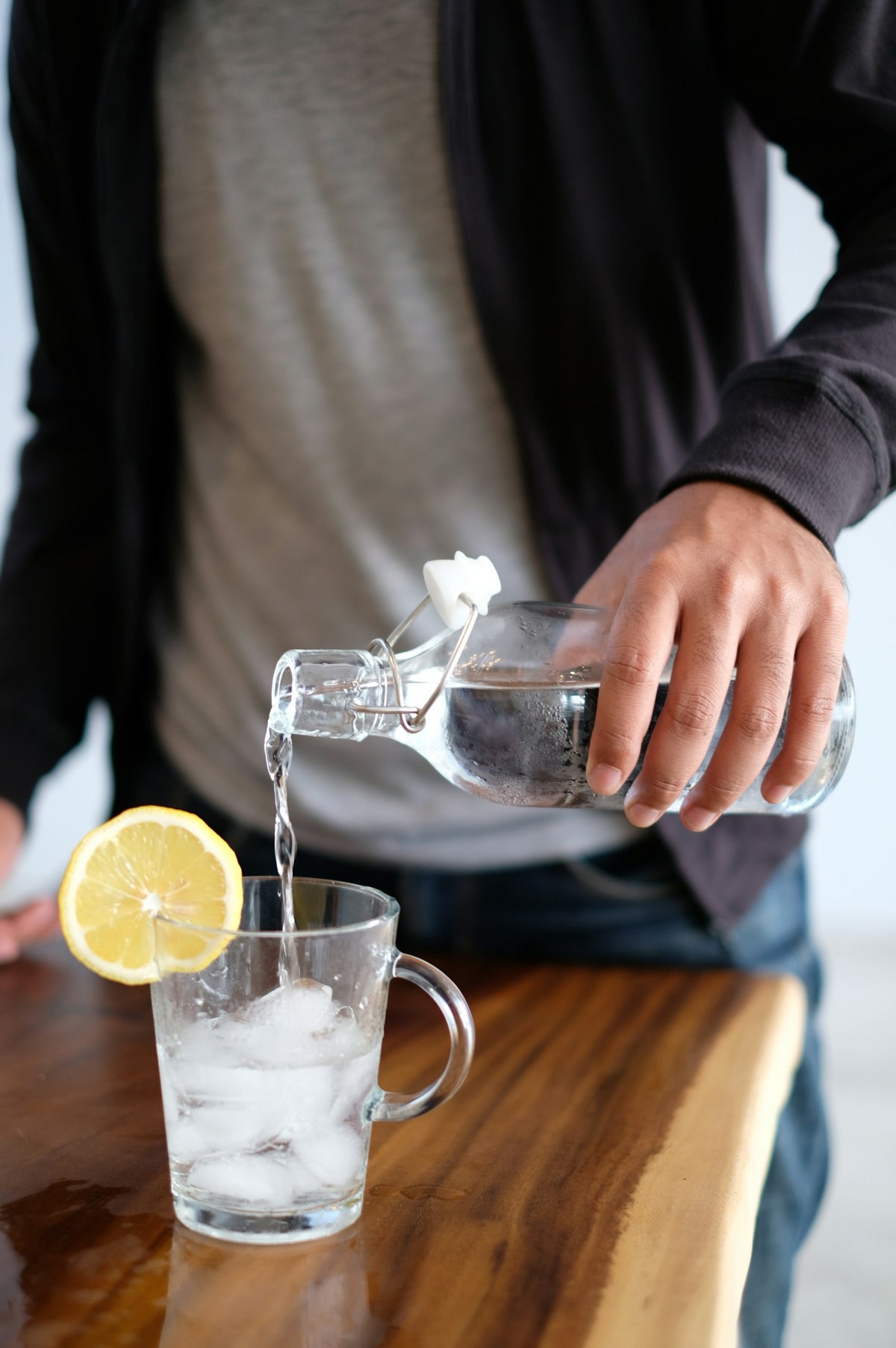 Pouring cold drinking water from a dispenser